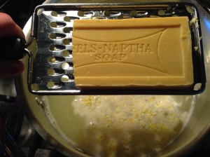 Grate 1/4 of the Fels Naptha Bar into the hot pot of water
