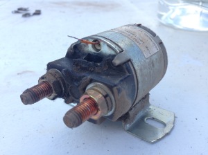 Old Solenoid. Notice the little wire exposed at the top...a nut of a sort is supposed to go on that. Crab totally ripped that little B off. 